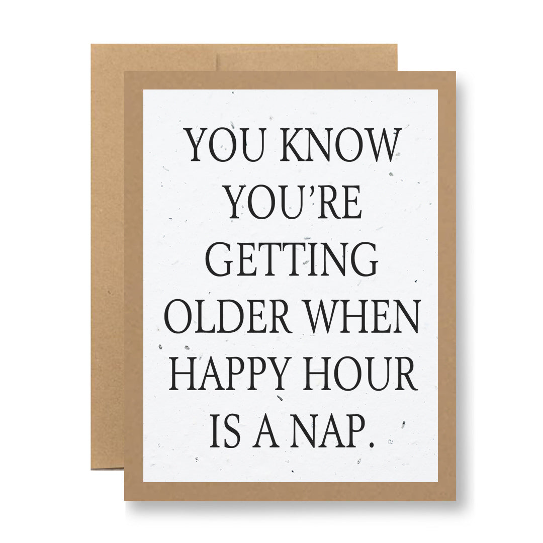 The item from My Store, known as the Plantable Greeting Card - ...happy hour is a nap, is crafted from recycled cardstock and features a brown border with the message: "You know you’re getting older when happy hour is a nap.