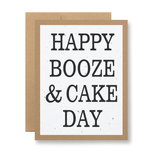 Introducing the "Plantable Greeting Card - Happy Booze & Cake Day" by My Store, featuring bold black text on a crisp white background with the playful message, "Happy Booze & Cake Day." Nestled within a stylish brown border, this eco-friendly card is made from handmade seed paper. After enjoying its cheerful greeting, plant it to reveal a wonderful surprise—vibrant wildflowers will bloom!