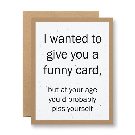 The Plantable Greeting Card by My Store, featuring the humorous text "I wanted to give you a funny card, but at your age you’d probably piss yourself," is crafted from wildflower seed embedded paper. It comes with a brown envelope and offers both laughter and an eco-friendly touch.