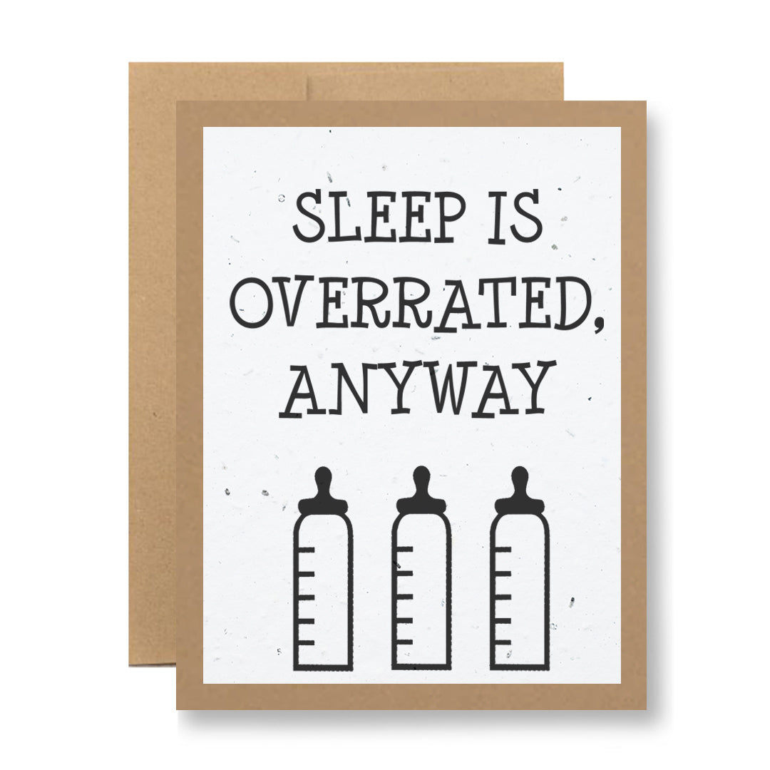 A Plantable Greeting Card from My Store titled "Sleep is overrated, anyway," showcases a playful message above three illustrated baby bottles. Made from seed paper with a minimalist design and brown border, it’s the ideal gift for those who enjoy humor and the potential of sprouting wildflowers.