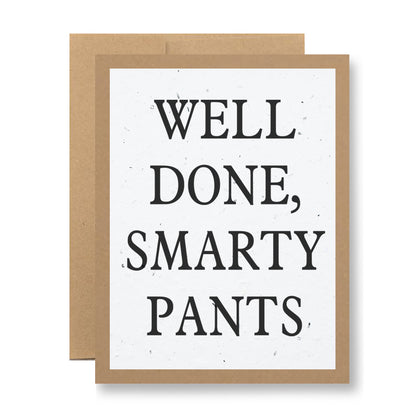 The Plantable Greeting Card - Well Done, Smarty Pants by My Store is designed with a brown border and is crafted from handmade seed paper. It features bold black text that reads "WELL DONE, SMARTY PANTS" and stands proudly against a plain background. Once planted, this eco-friendly card will bloom with wildflower seeds.