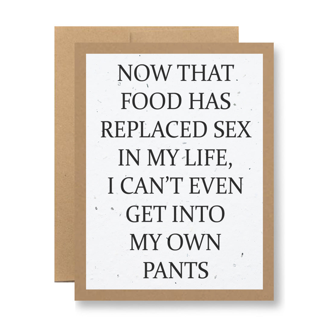 A card from the brand My Store, named "Plantable Greeting Card - ...get into my own pants," features a humorous text that reads, "Now that food has replaced sex in my life, I can't even get into my own pants." It is printed on biodegradable material and set against a plain background with a brown border.