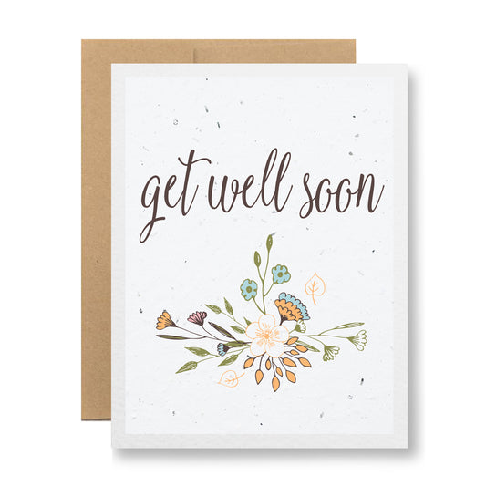 Introducing the "Get Well Soon" Plantable Greeting Card by My Store, featuring an elegant script and a floral sketch design with vibrant wildflower seeds on a soft background. Crafted from biodegradable materials, it comes with a matching brown envelope.