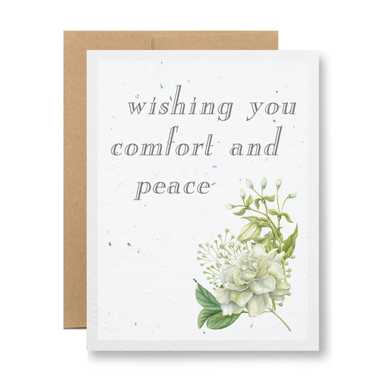 Introducing the "Plantable Greeting Card - Wishing you comfort and peace" by My Store. This sympathy card features an elegant font and a beautiful illustration of white and green flowers on biodegradable cards. It comes with a brown envelope and is made from handmade seed paper, allowing you to honor the memory of your loved one by planting wildflower seeds.