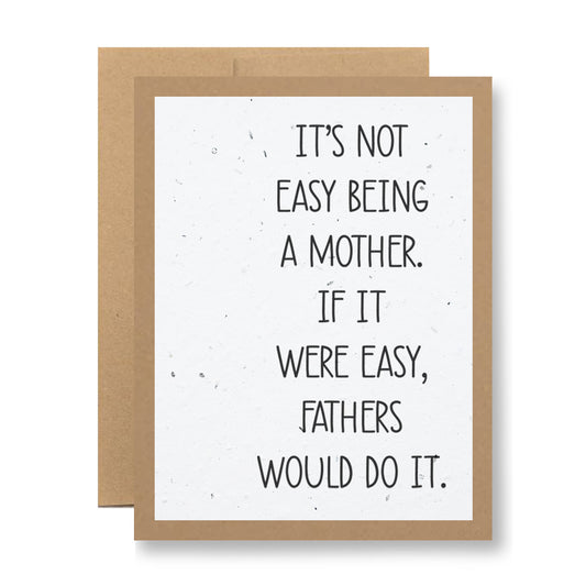 A Plantable Greeting Card from My Store reads, "It's not easy being a mother. If it were easy, fathers would do it." This eco-friendly card is crafted from recycled cardstock and features a plain brown border with a white background and black lettering.