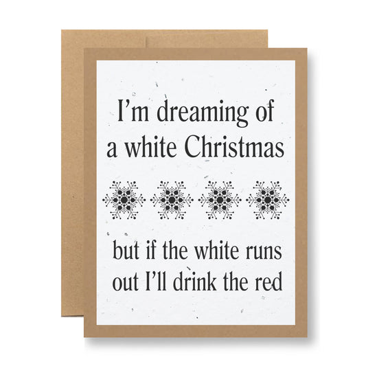 The "Plantable Greeting Card - I'm dreaming of a white Christmas..." by My Store is crafted from biodegradable seed paper. It features the text: "I'm dreaming of a white Christmas, but if the white runs out, I'll drink the red," along with snowflake illustrations. Plant this card for a blooming reminder of holiday joy with wildflowers.